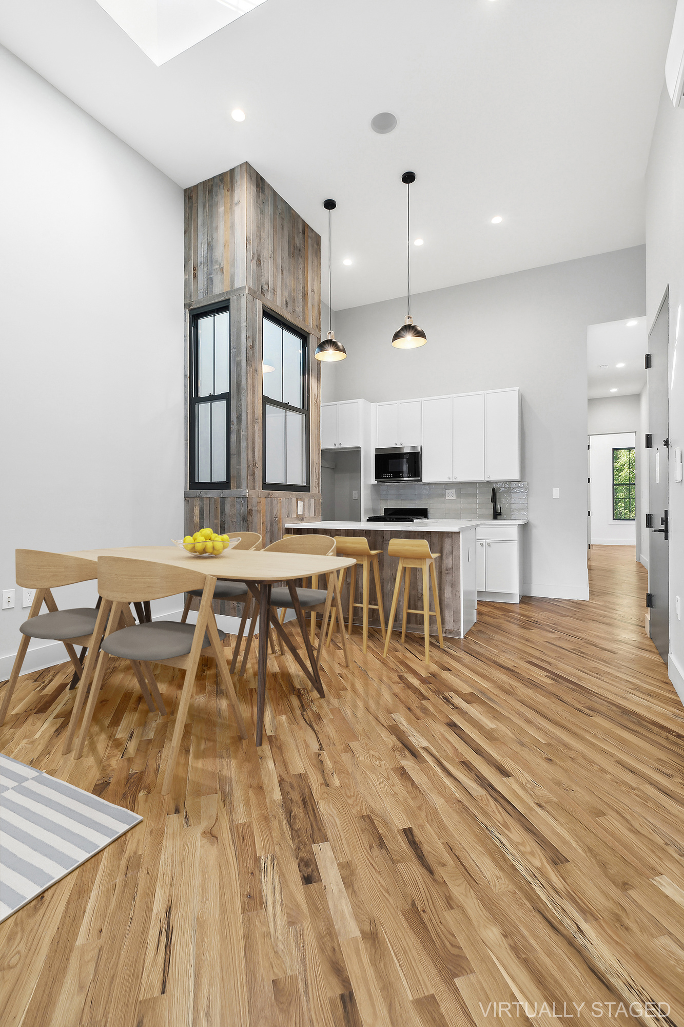 a living room with furniture and kitchen view