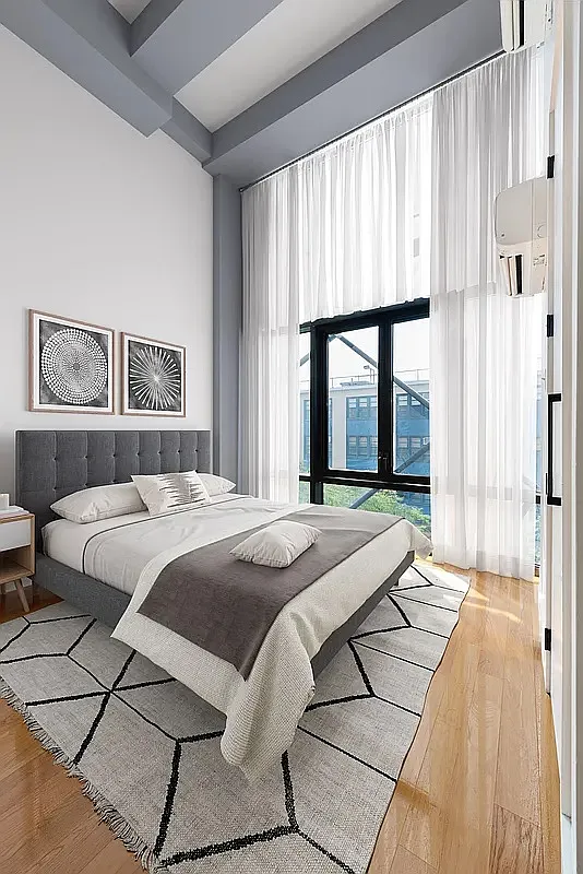 30 Starr Street, Unit 4B Brooklyn, NY 11221 - Photo 1 of 5 a bedroom with a bed and a large window