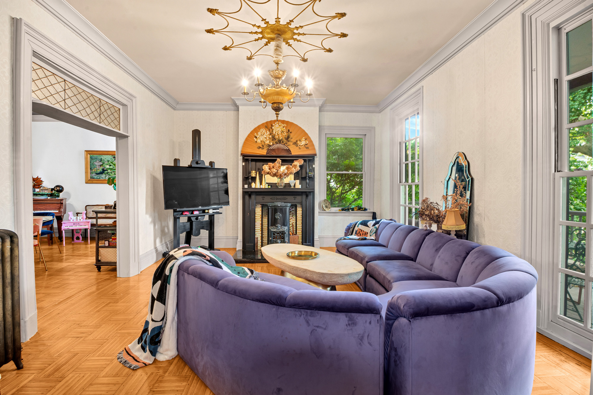 117 Tysen Street Staten Island, NY 10301 - Photo 4 of 19 a living room with fireplace furniture and a flat screen tv