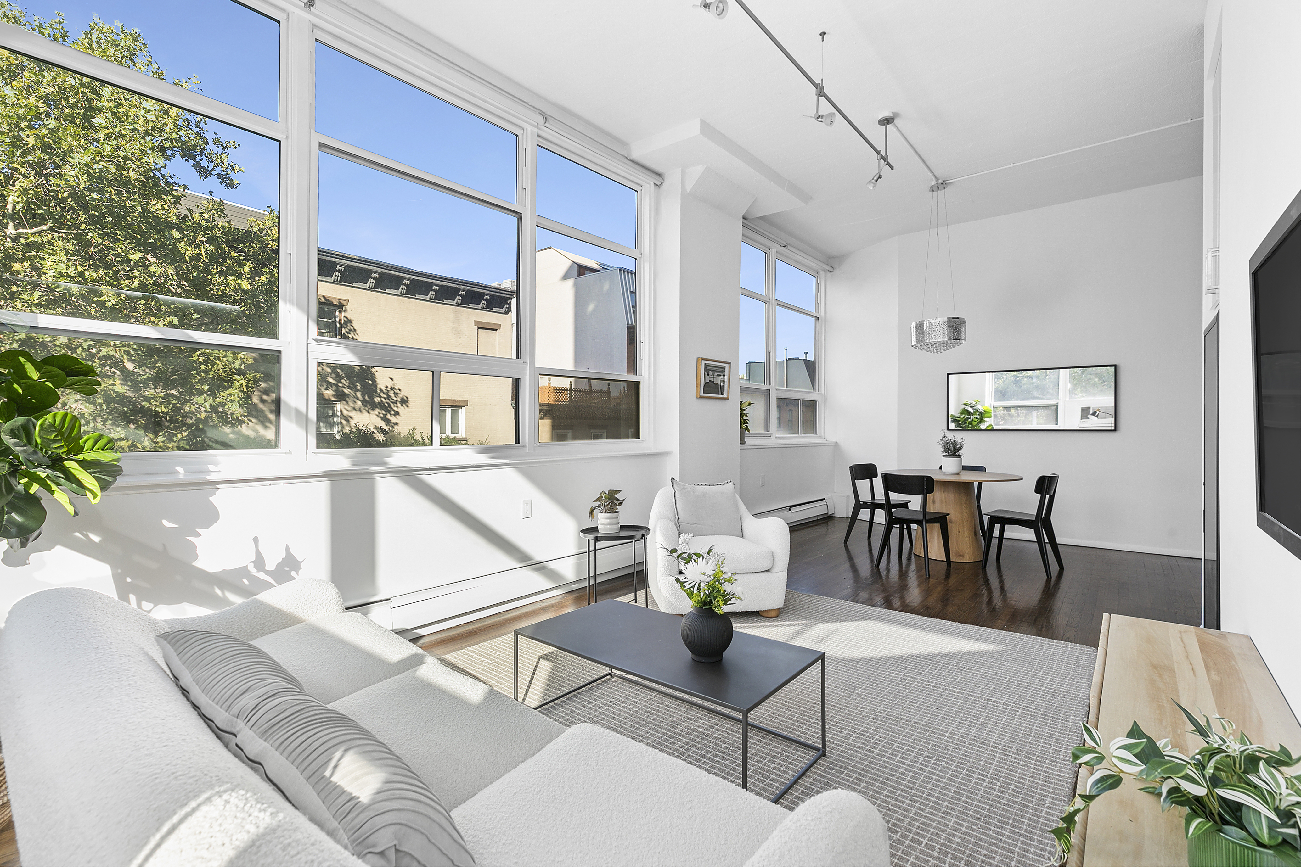 505 Court Street, Unit 3D Brooklyn, NY 11231 - Photo 3 of 14 a living room with furniture a dining table and a large window
