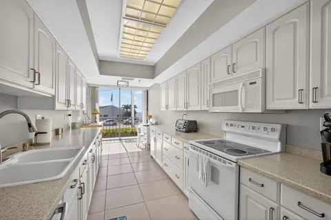 a bedroom with a bed and painting on the wall