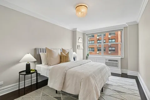 a bedroom with a bed and window