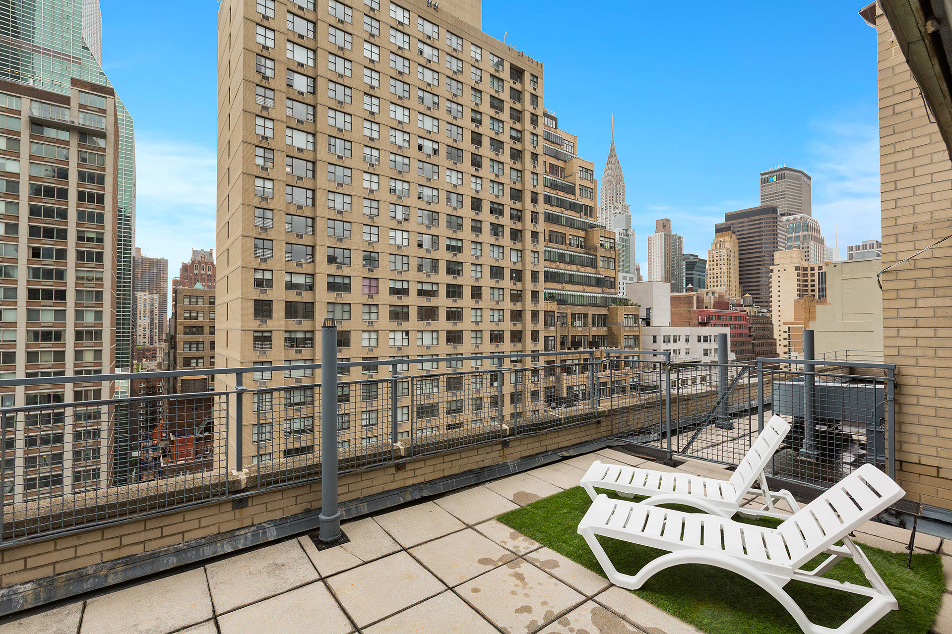 333 East 46th Street, Unit 5K Manhattan, NY 10017 - Photo 5 of 7 a view of a balcony with a couch