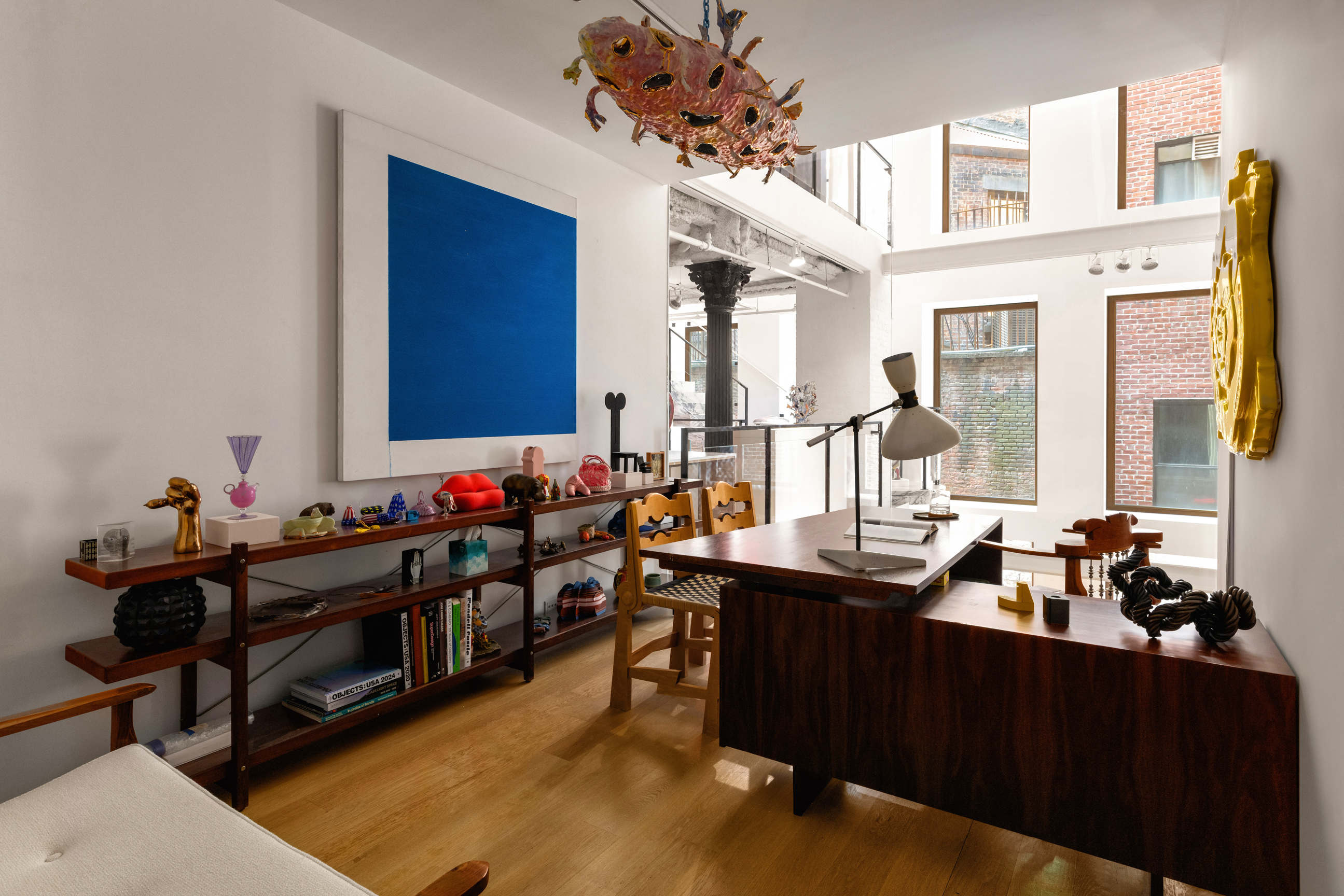 64 White Street, Unit RETAIL Manhattan, NY 10013 - Photo 12 of 21 a view of a workspace with a window and couch