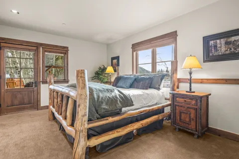 a bed room with a bed and a window