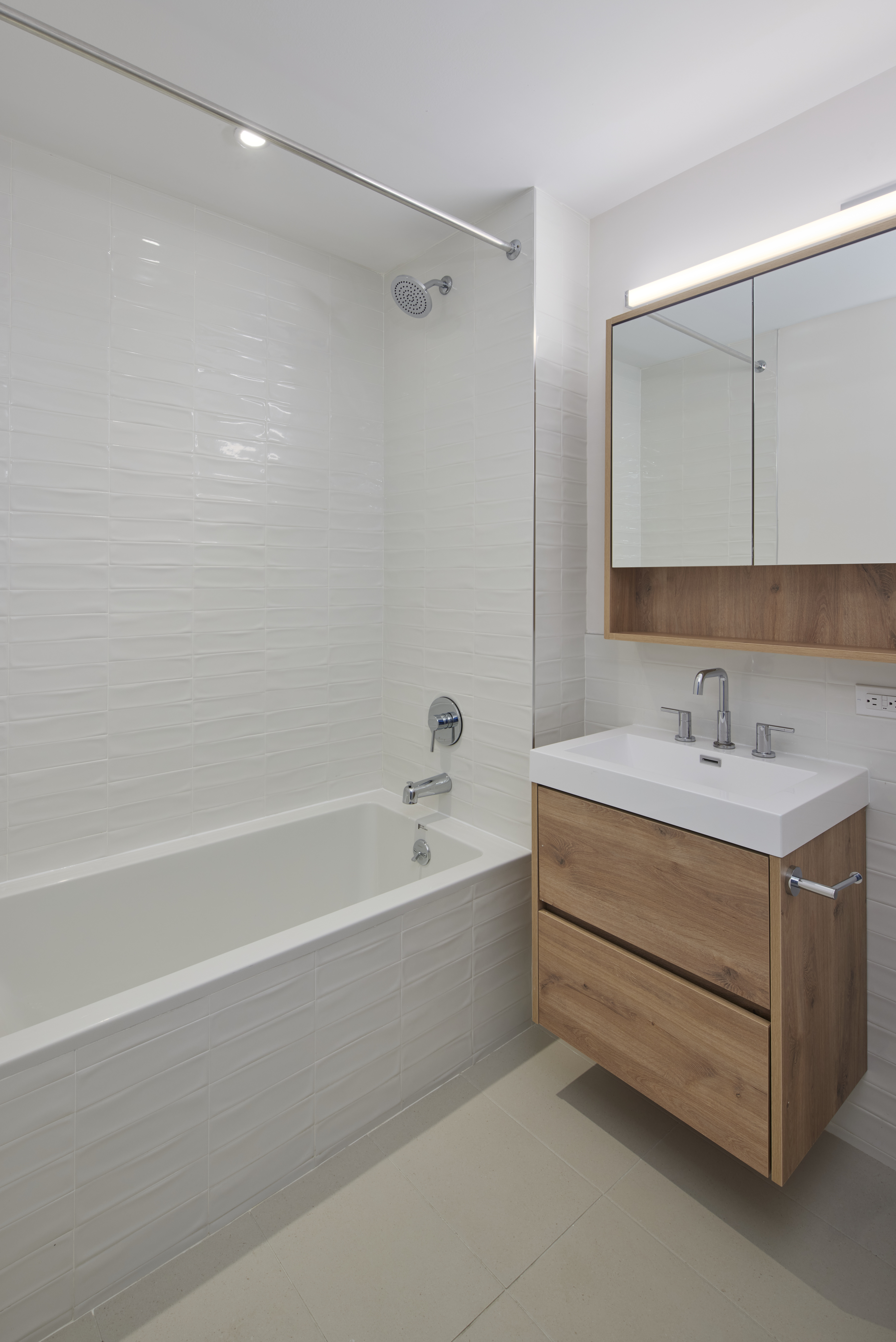 340 Lenox Road, Unit 4E Brooklyn, NY 11226 - Photo 7 of 25 a bathroom with a bathtub and a sink