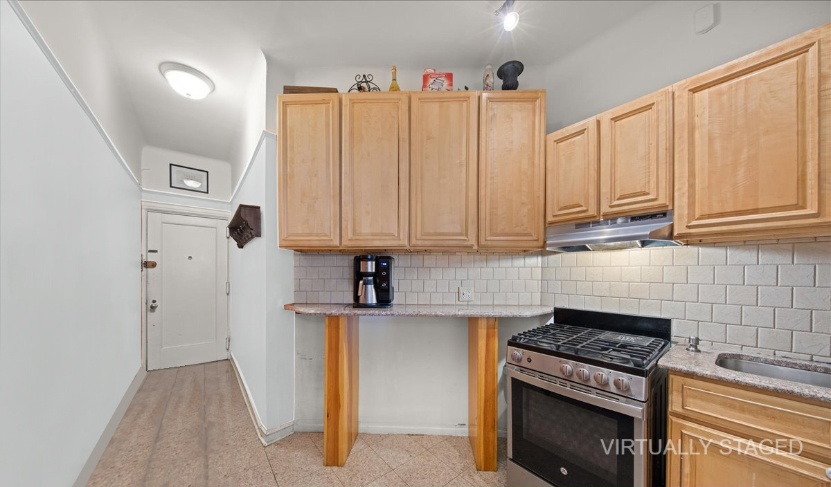 2 Marine Avenue, Unit 1B Brooklyn, NY 11209 - Photo 5 of 14 a kitchen with appliances a stove a sink and cabinets