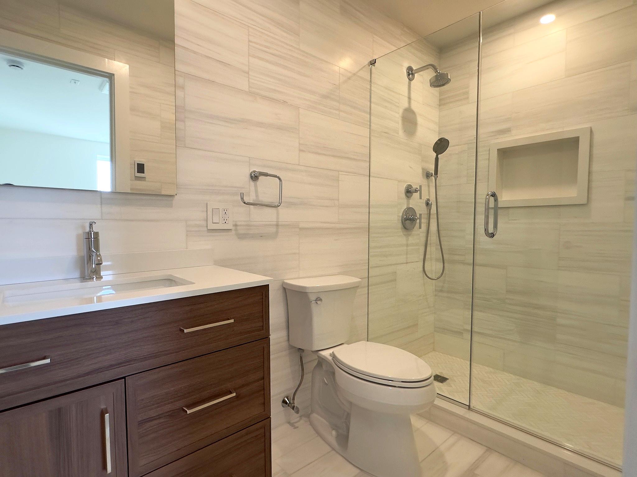 156 Summit Street, Unit 1 Brooklyn, NY 11231 - Photo 5 of 6 a bathroom with a sink a toilet and shower