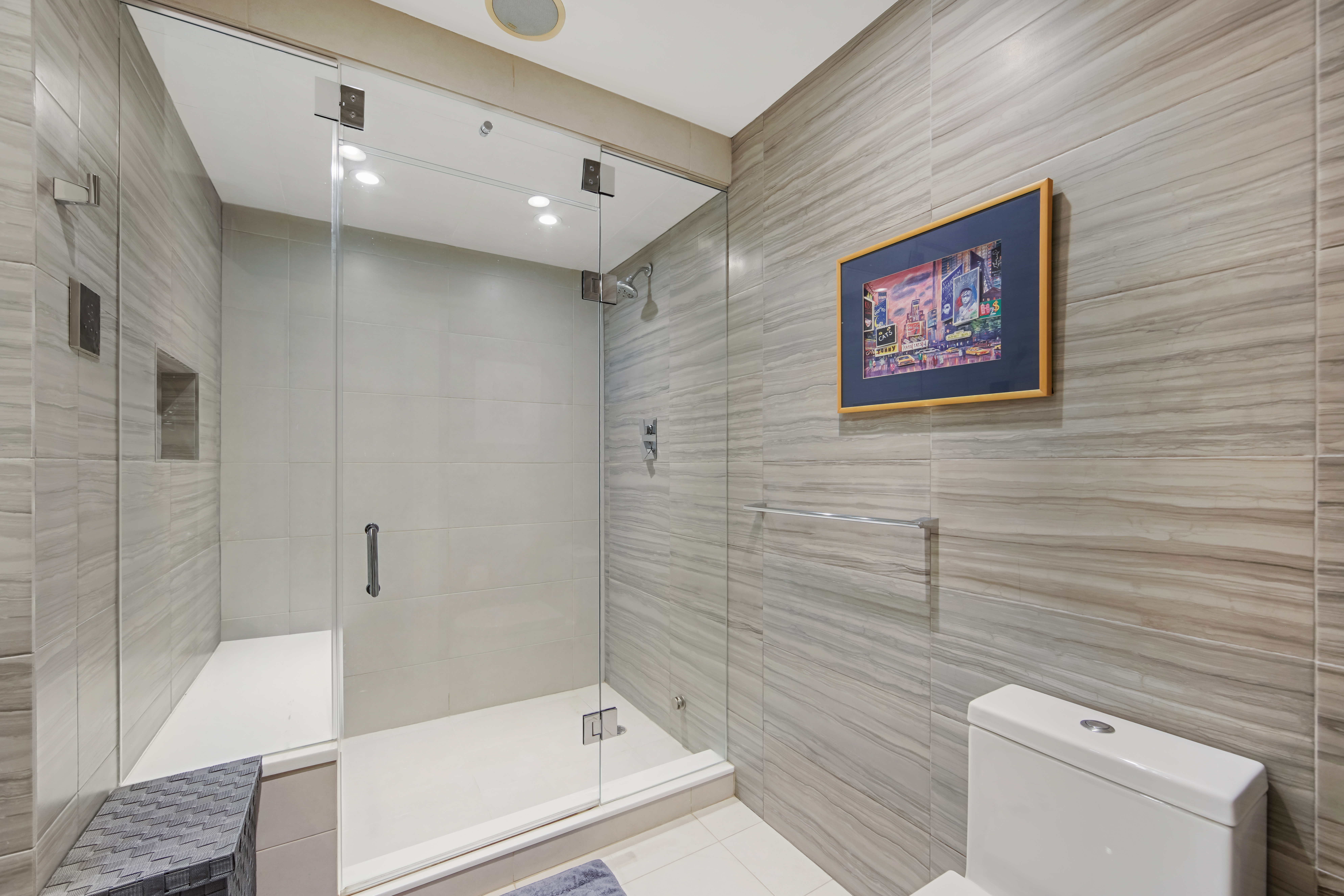425 East 58th Street, Unit 29C Manhattan, NY 10022 - Photo 7 of 9 a bathroom with a bathtub and a shower