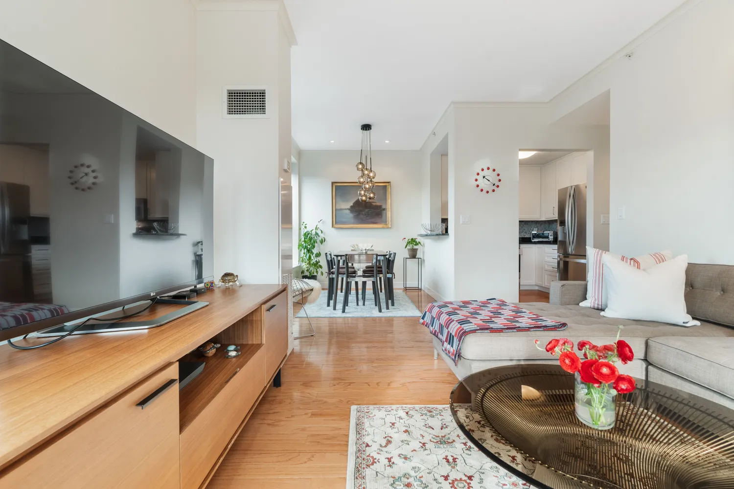 a living room with furniture and flat screen tv