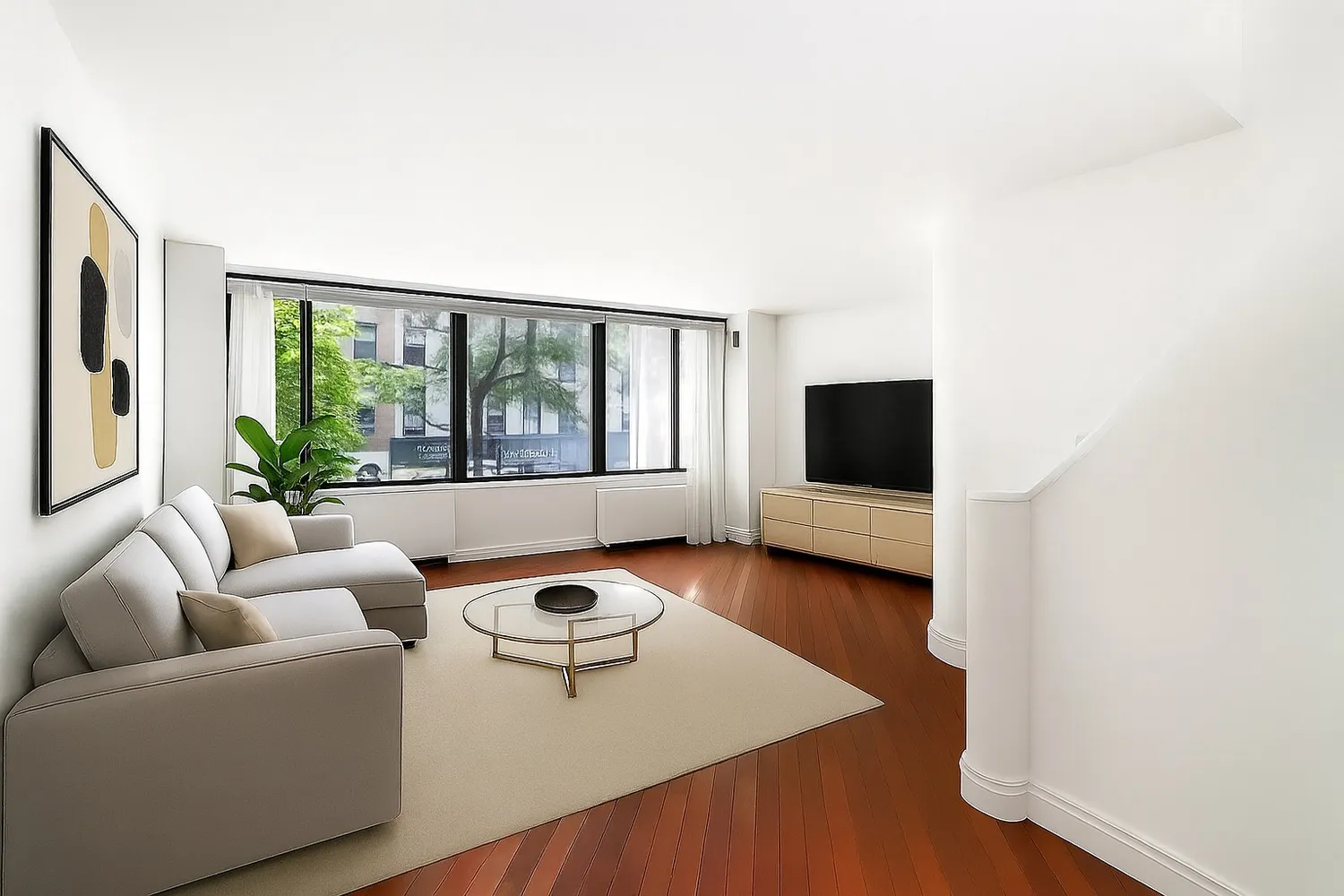 a living room with furniture and a flat screen tv