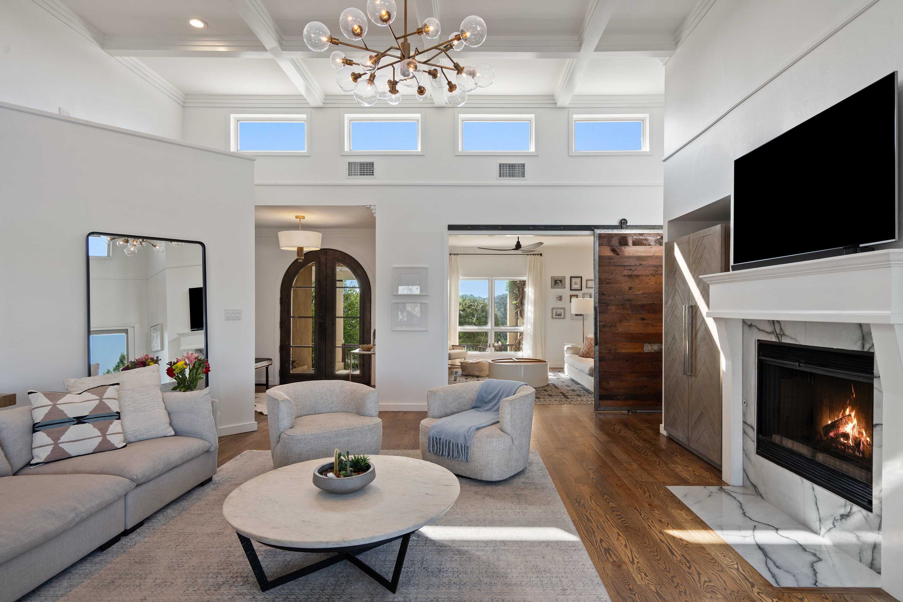 5319 Backtrail Drive Austin, TX 78731 - Photo 9 of 35 a living room with furniture a fireplace and a flat screen tv
