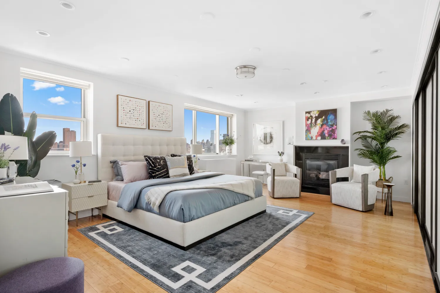 a spacious bedroom with a bed and window