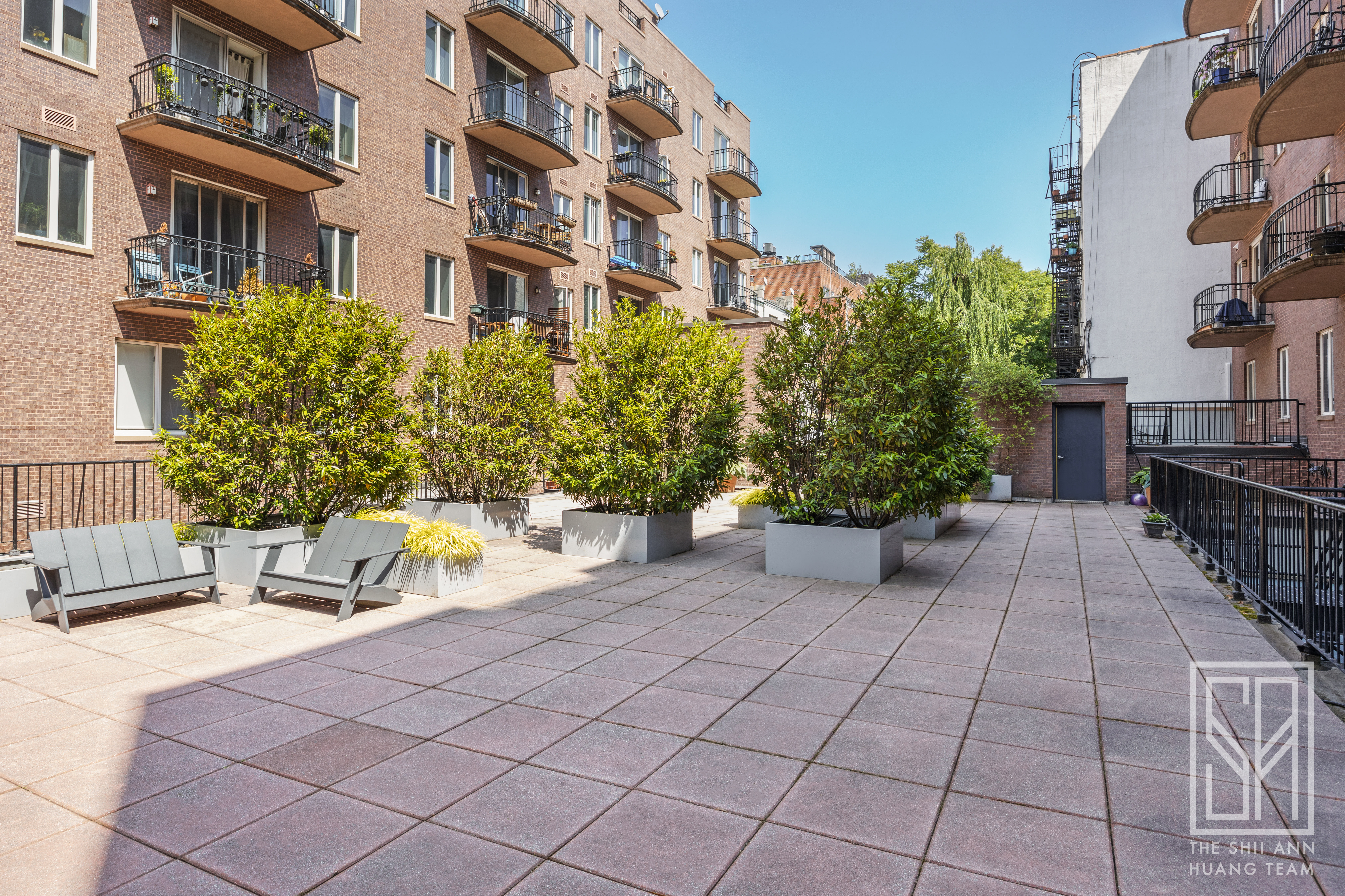 305 3rd Street, Unit 2H Brooklyn, NY 11215 - Photo 12 of 14 a view of a patio with a table and chairs and potted plants