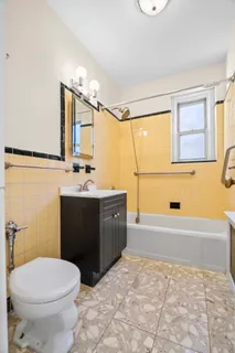 a bathroom with a sink a toilet and mirror