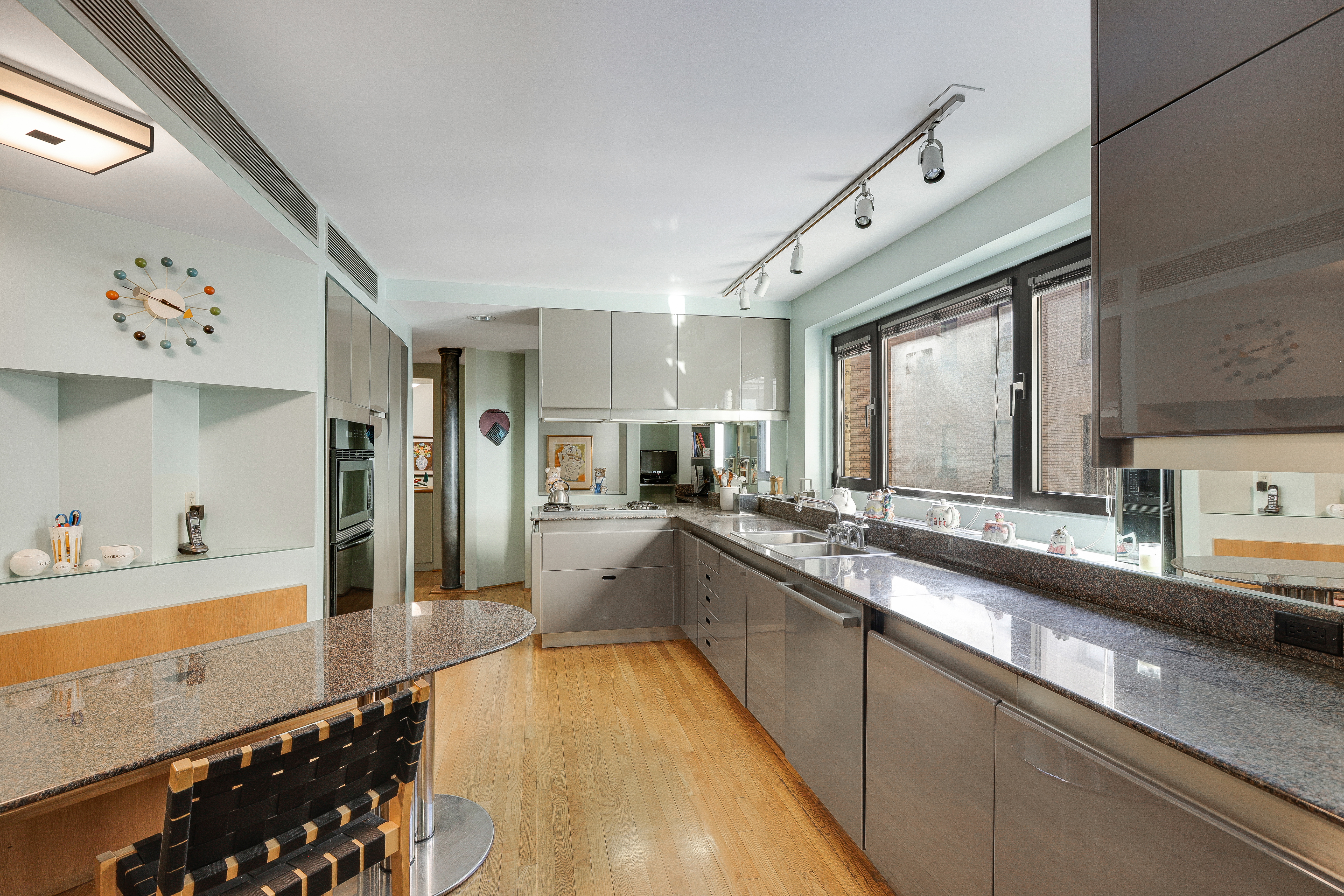 1175 Park Avenue, Unit 13B Manhattan, NY 10128 - Photo 8 of 12 a large white kitchen with a large window