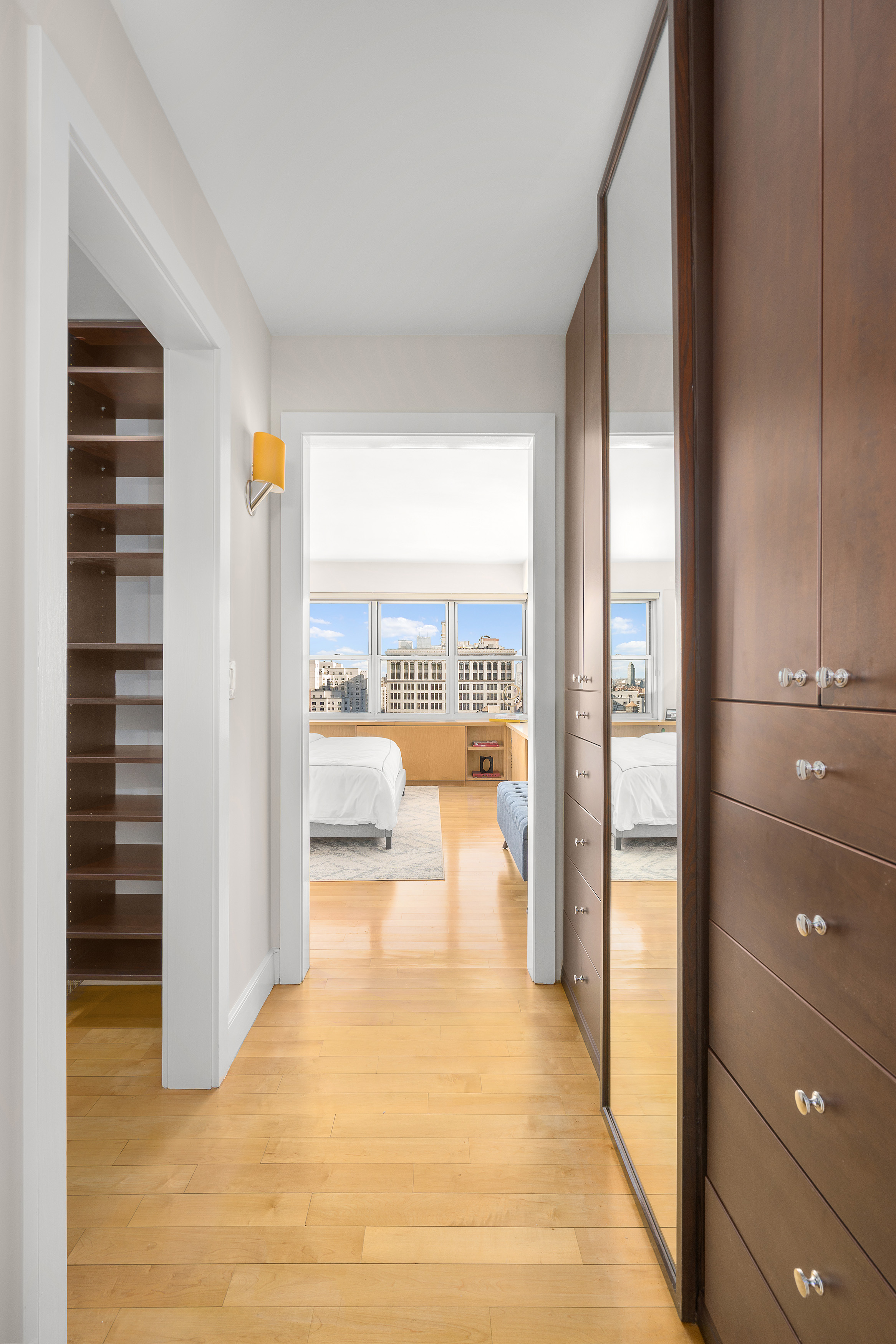 20 East 9th Street, Unit 22C Manhattan, NY 10003 - Photo 6 of 21 a living room filled with furniture and a floor to ceiling window
