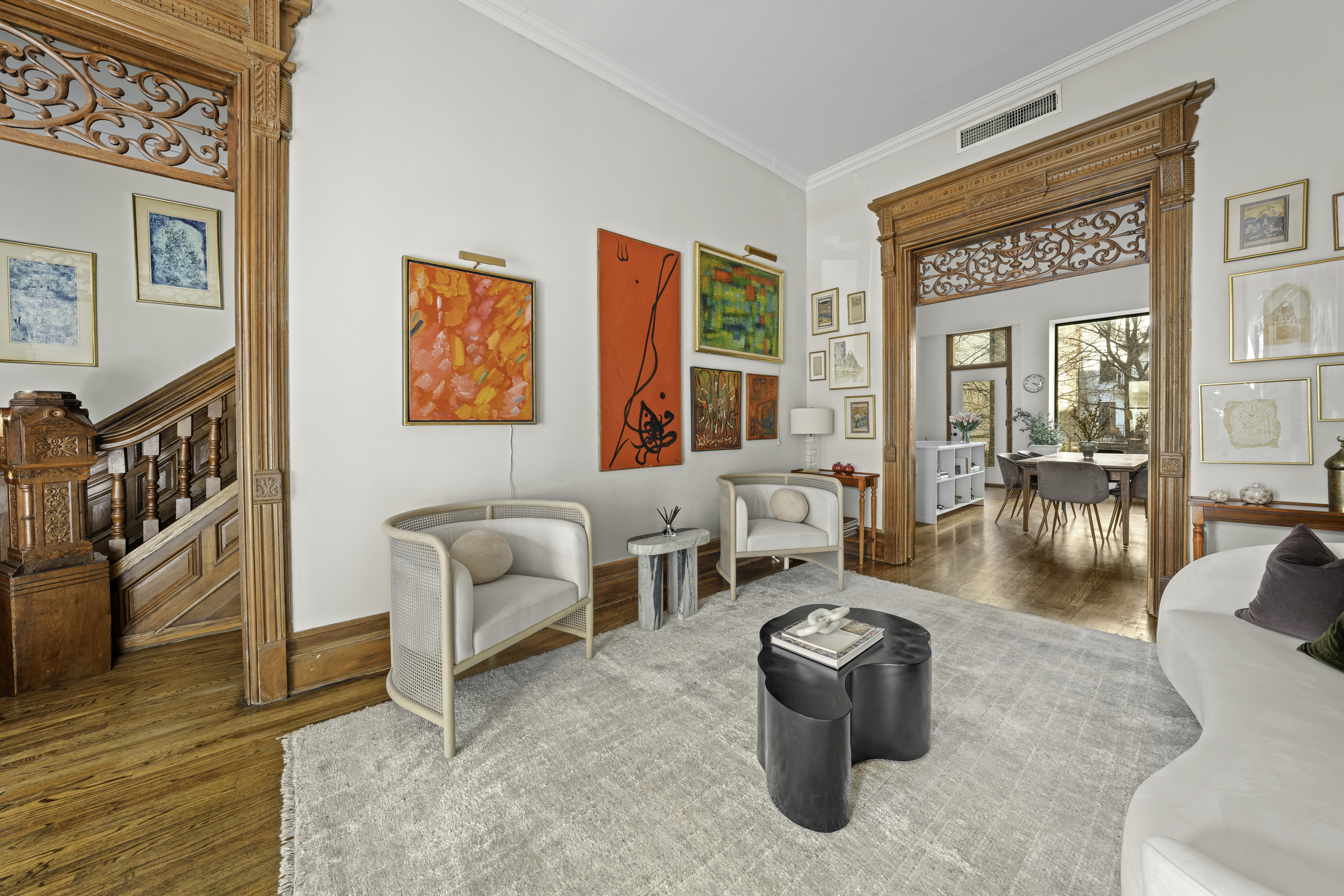 127 West 122nd Street Manhattan, NY 10027 - Photo 4 of 17 a living room with furniture and a floor to ceiling window