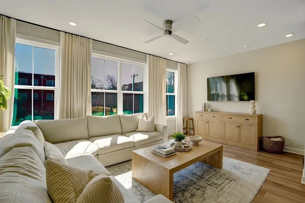 a living room with furniture and a flat screen tv