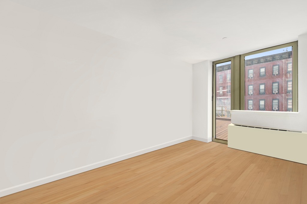 2132 2nd Avenue, Unit 2D Manhattan, NY 10029 - Photo 2 of 6 a view of an empty room with window