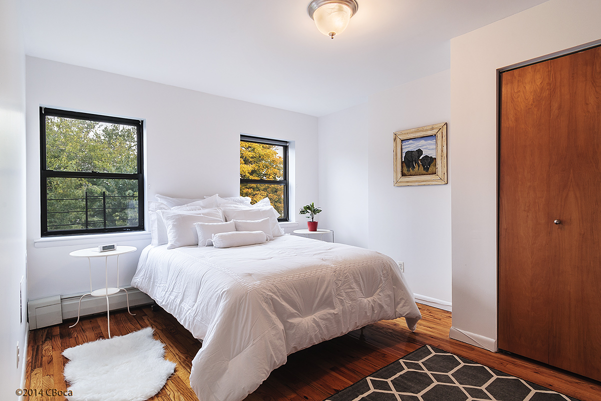 404 Classon Avenue, Unit 2 Brooklyn, NY 11238 - Photo 12 of 14 a bedroom with a bed and a window