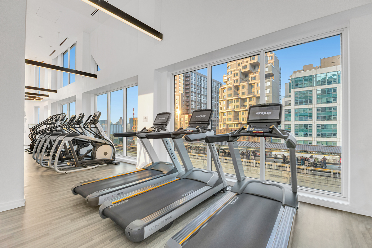 24-16 Queens Plaza South, Unit 4J Queens, NY 11101 - Photo 11 of 15 a view of a room with gym equipment