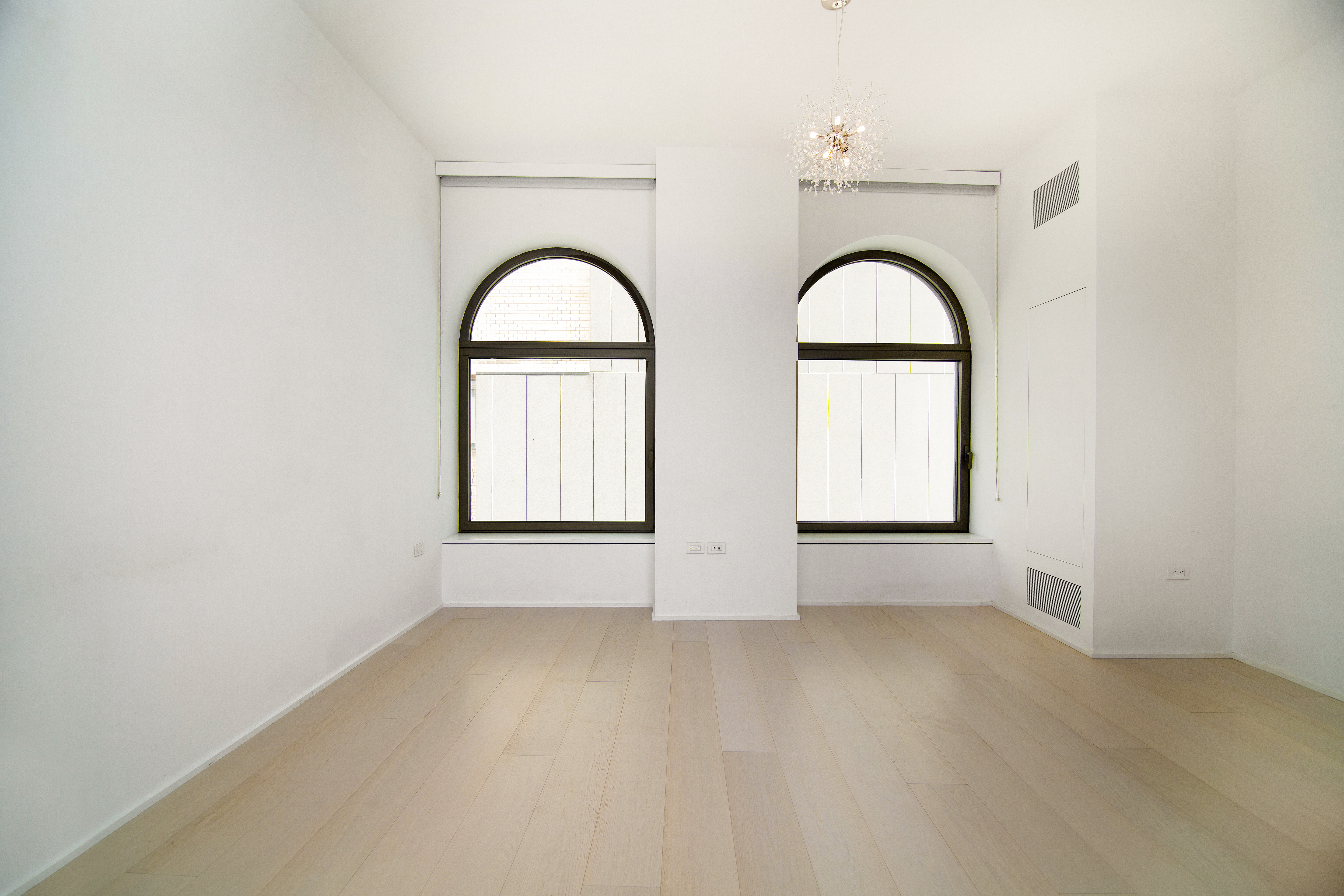 130 William Street, Unit 9E Manhattan, NY 10038 - Photo 10 of 16 an empty room with a window