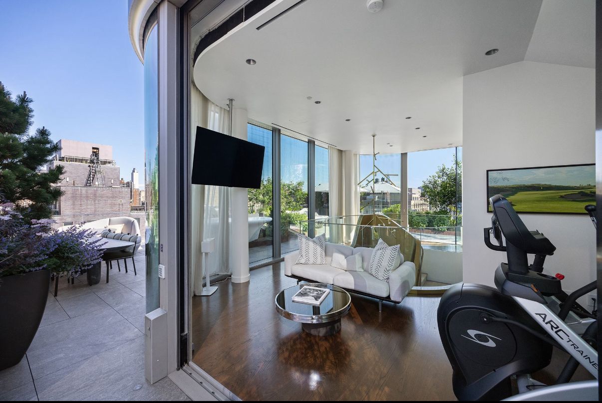 520 West 28th Street, Unit PH37 Manhattan, NY 10001 - Photo 33 of 45 a living room with furniture and a flat screen tv
