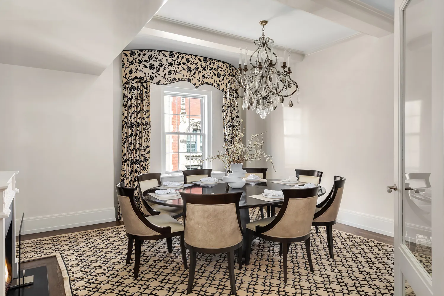 a dining room with furniture and window
