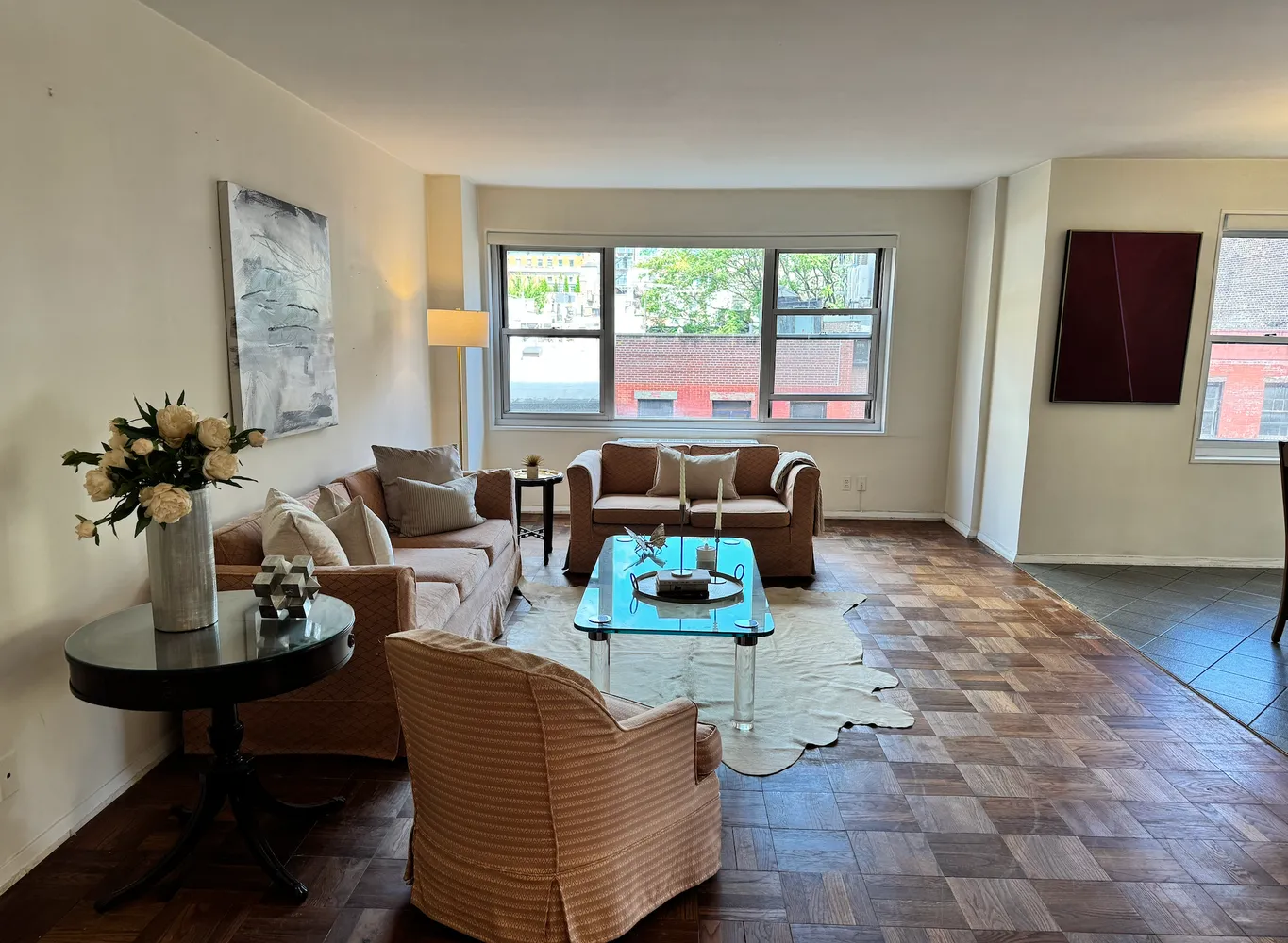 a living room with furniture and a window