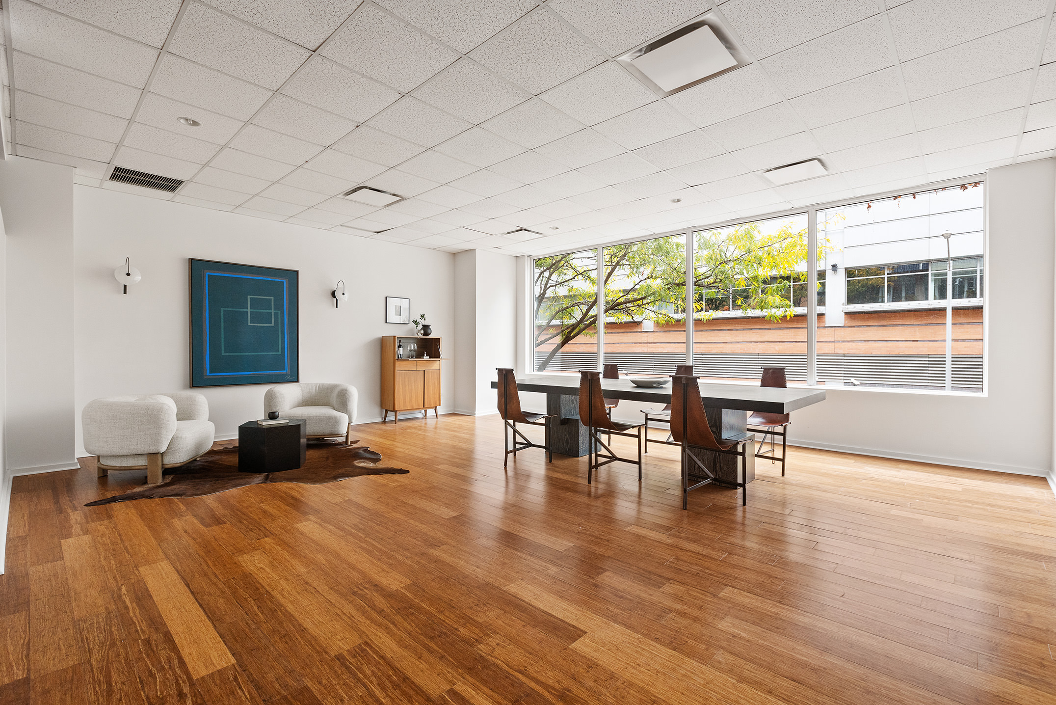 345 West 54th Street Manhattan, NY 10019 - Photo 19 of 22 a living room with furniture and wooden floor