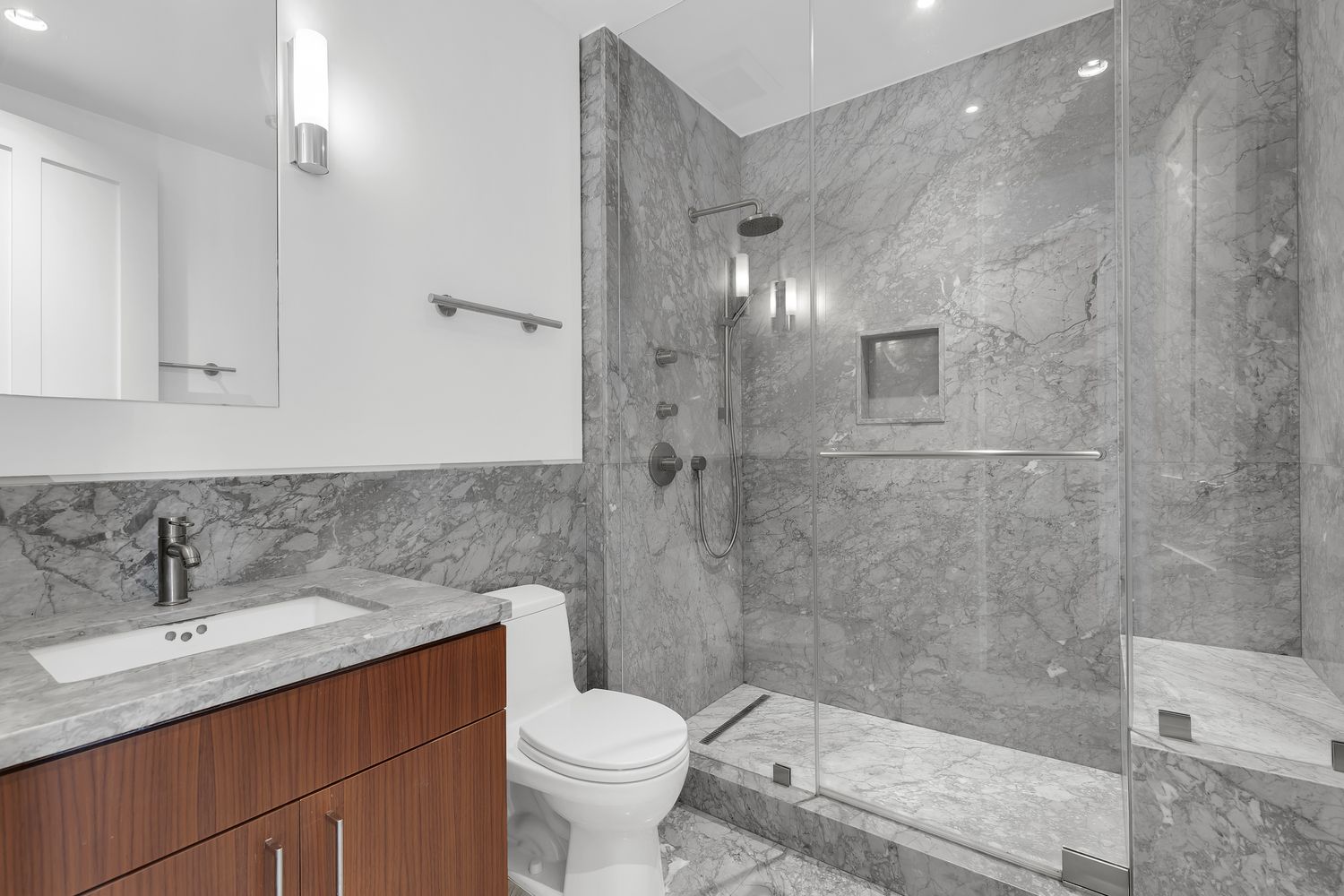 42 West 71st Street Manhattan, NY 10023 - Photo 23 of 35 a bathroom with a sink toilet a mirror and shower