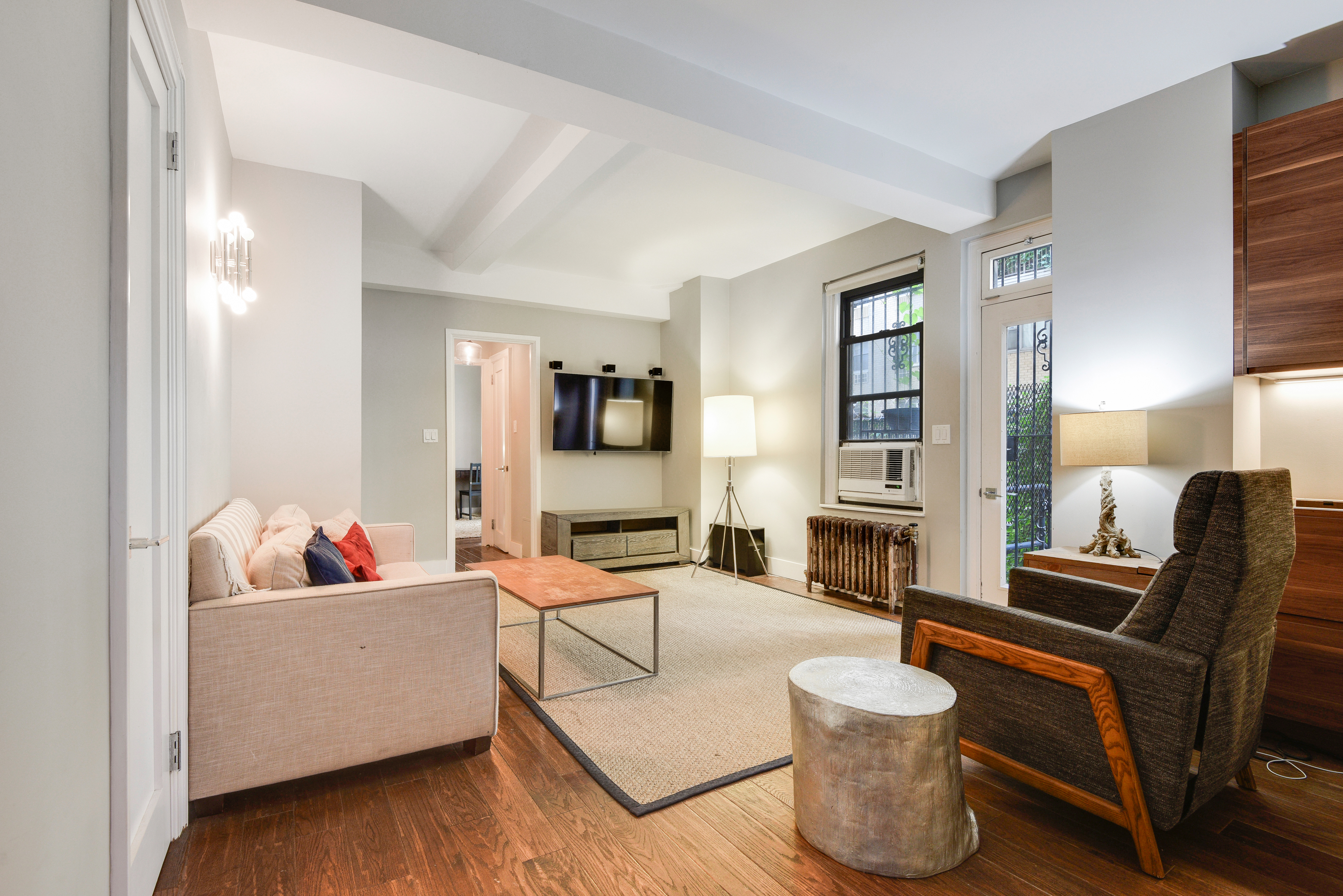 41 West 96th Street, Unit 1B Manhattan, NY 10025 - Photo 12 of 24 a living room with furniture and a flat screen tv