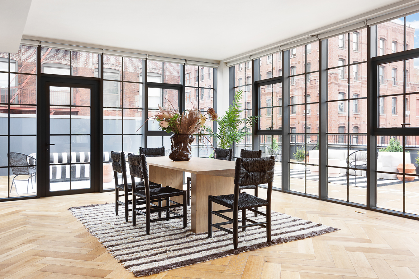 51 Jay Street, Unit PHE Brooklyn, NY 11201 - Photo 10 of 23 a view of a dining room with furniture window and wooden floor