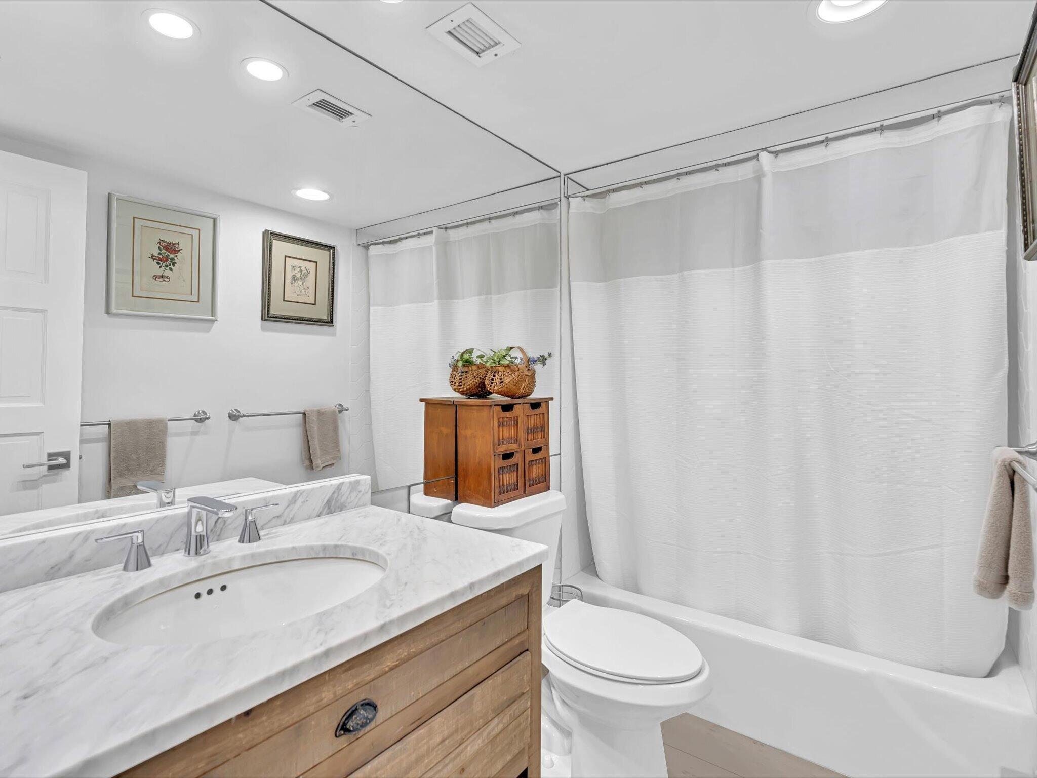 3000 South Ocean Boulevard, Unit 1504 Boca Raton, FL 33432 - Photo 20 of 64 a bathroom with a granite countertop sink a toilet and shower