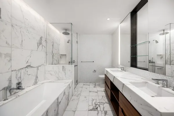 a bathroom with a bathtub and a sink