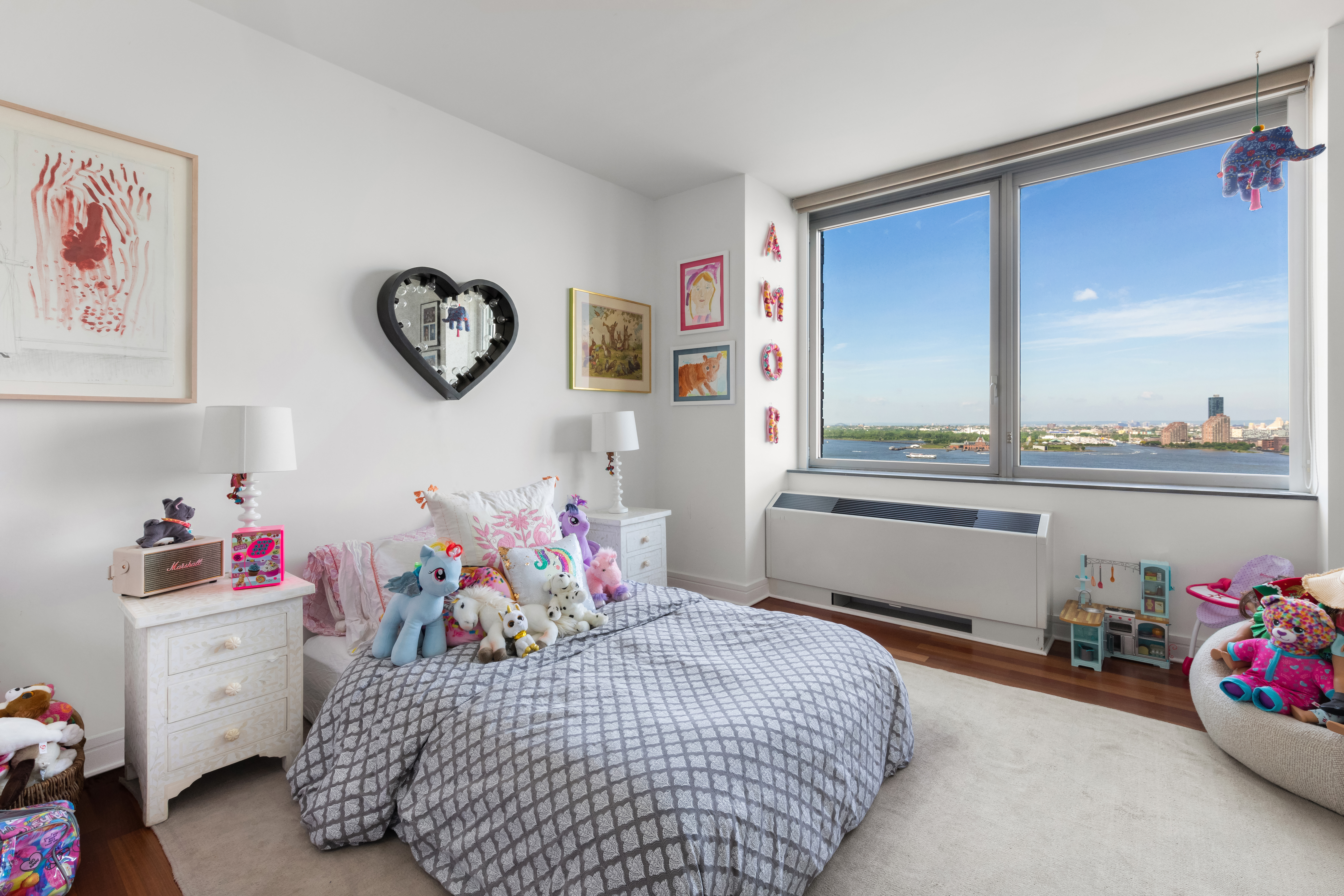 30 West Street, Unit 23F Manhattan, NY 10004 - Photo 6 of 12 a bedroom with a bed and a window