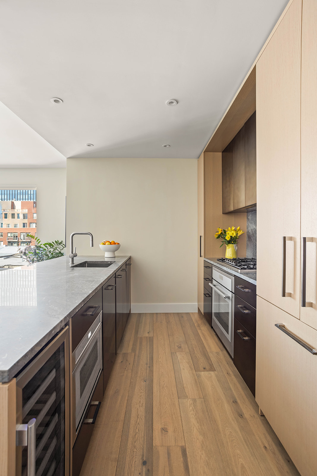 561 Pacific Street, Unit 606 Brooklyn, NY 11217 - Photo 4 of 17 a kitchen with granite countertop a sink cabinets and stainless steel appliances