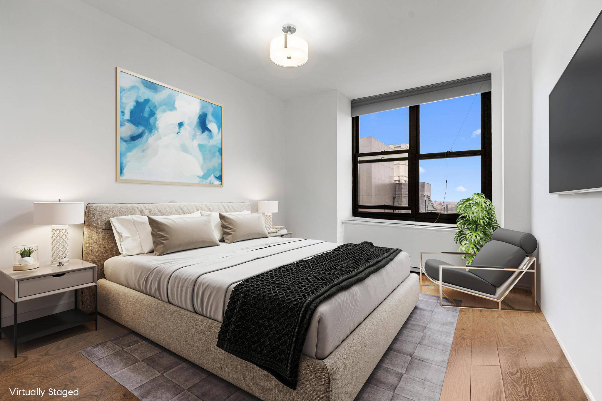 117 East 57th Street, Unit 48G Manhattan, NY 10022 - Photo 3 of 13 a bedroom with bed and a couch