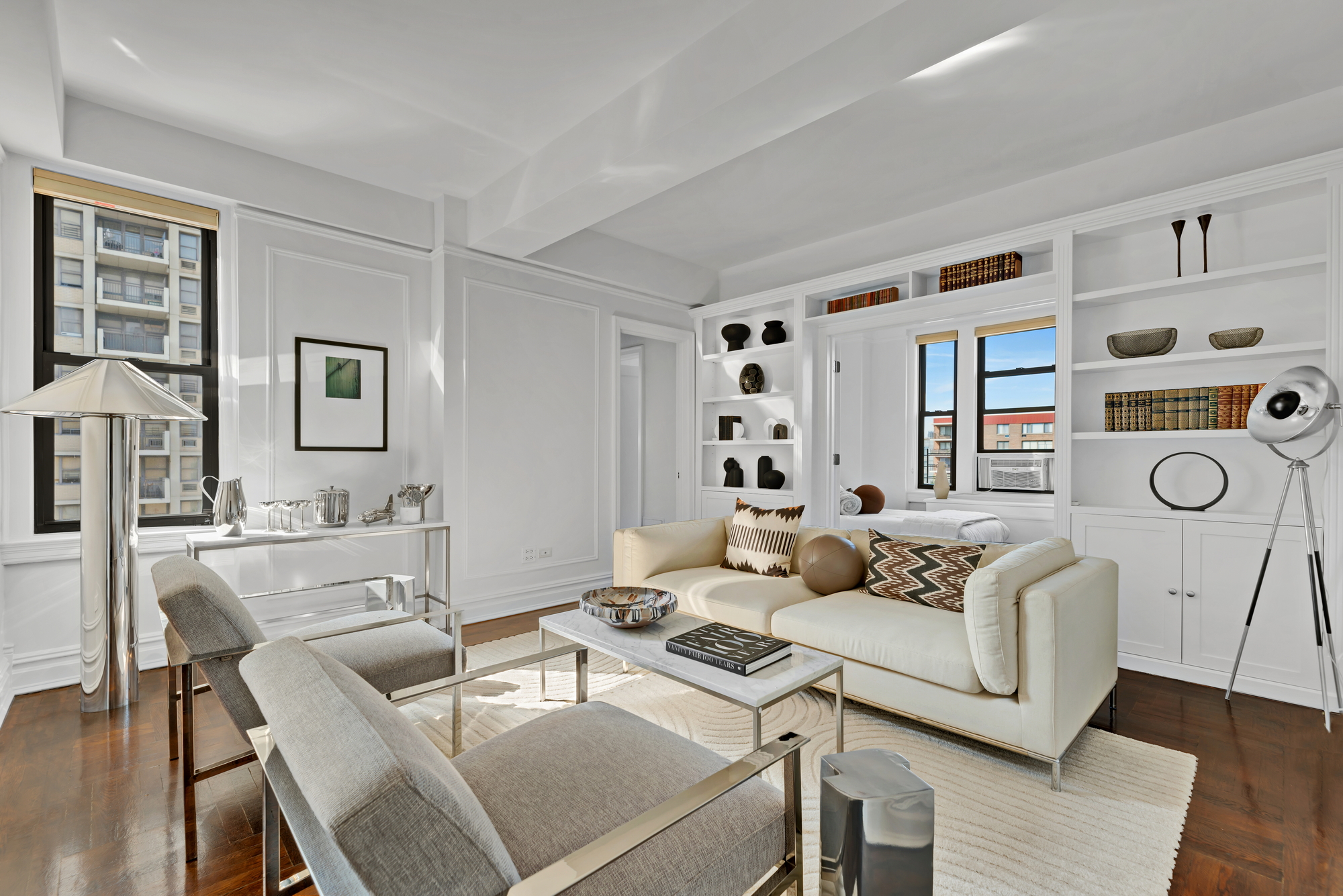 a living room with furniture and wooden floor