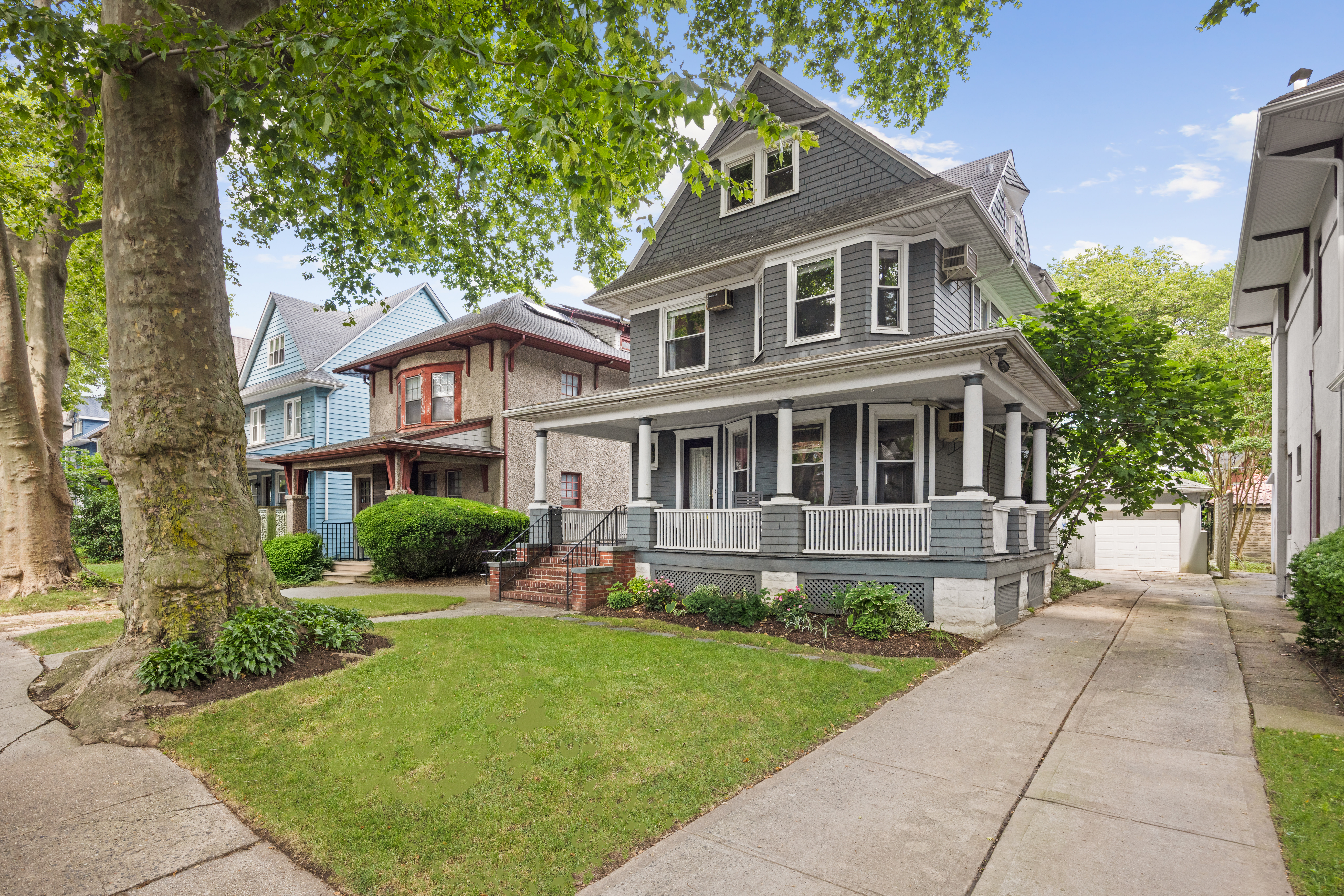 481 Stratford Road Brooklyn, NY 11218 - Photo 24 of 25 a front view of a house with a yard and trees