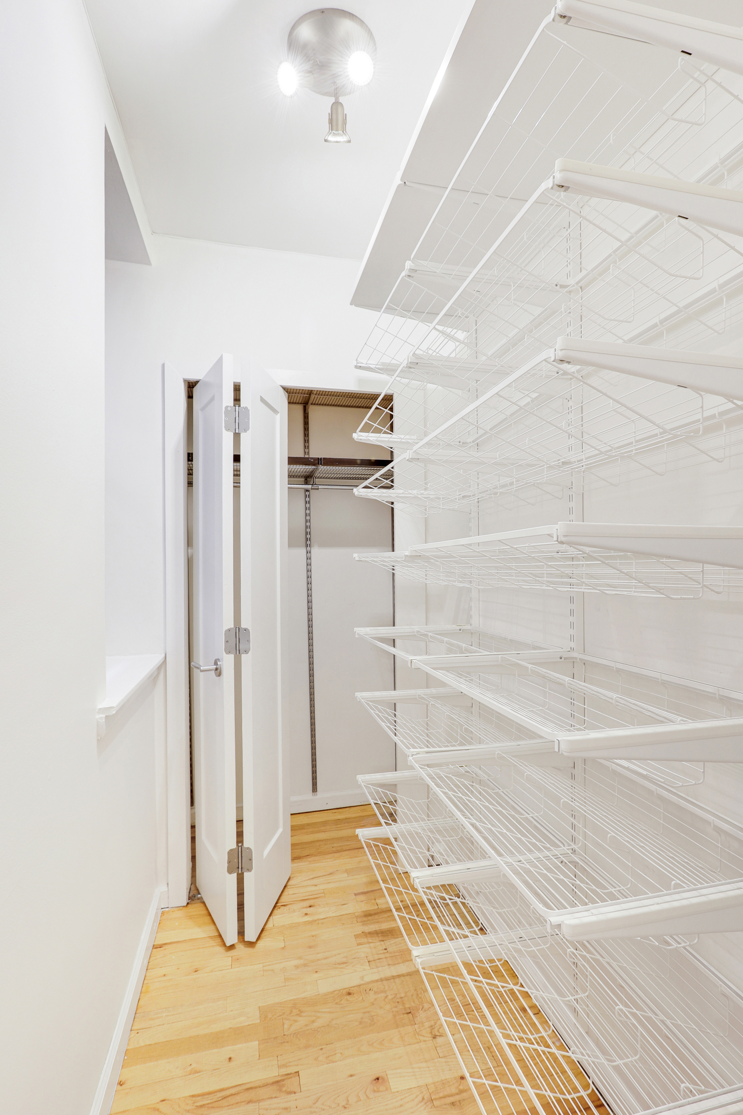 66-72 St Nicholas Avenue, Unit 3G Manhattan, NY 10026 - Photo 13 of 15 a bathroom with a sink and a shower