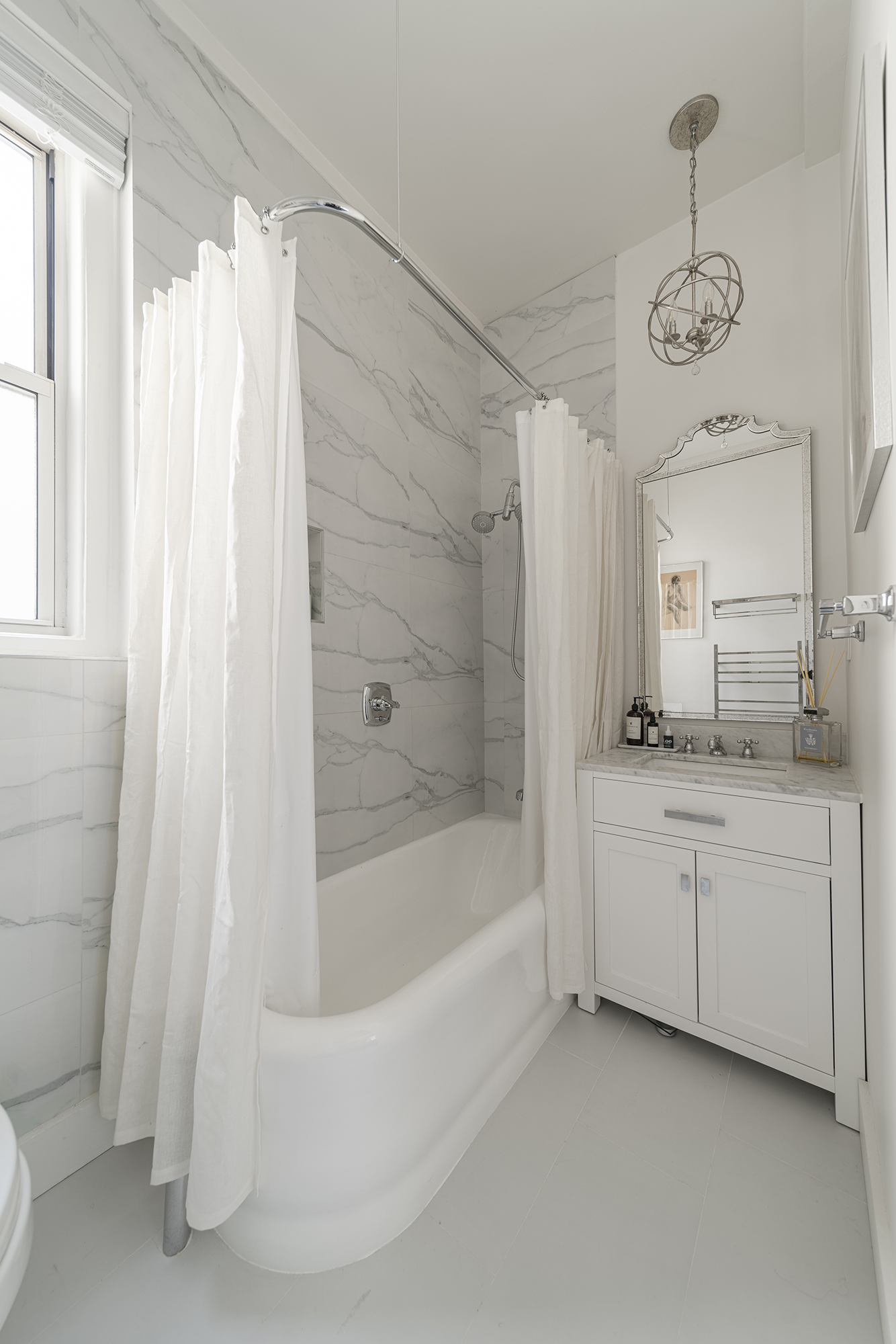 302 West 86th Street, Unit 11C Manhattan, NY 10024 - Photo 8 of 16 a bathroom with a bathtub a sink and a shower