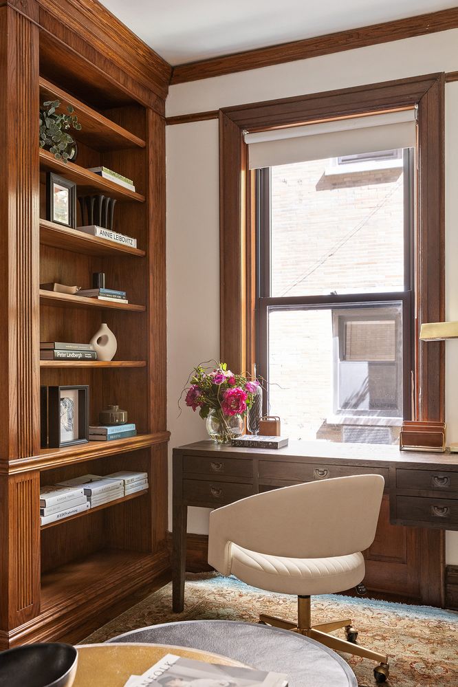 a room with a chair and a potted plant