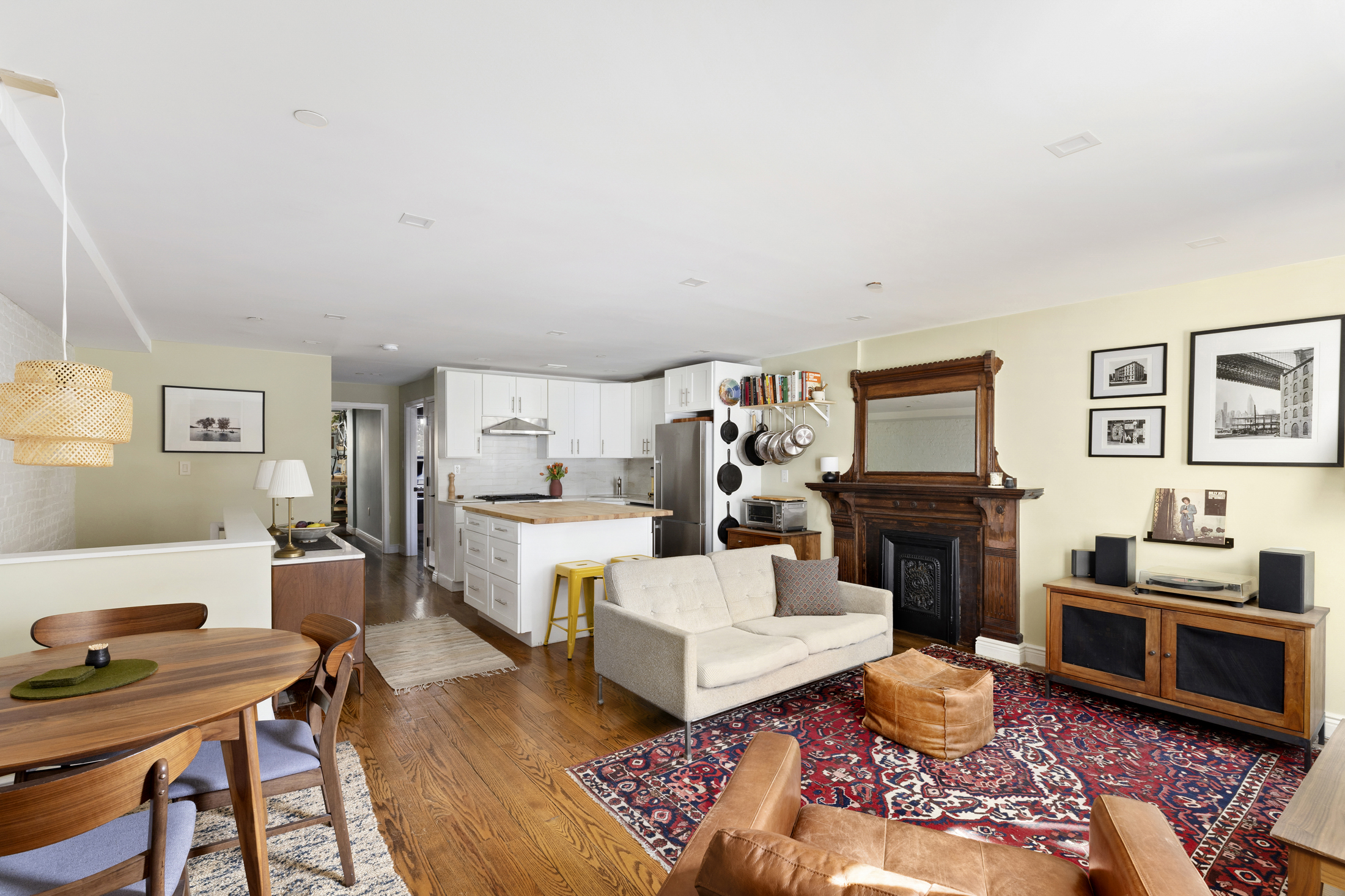 437 Putnam Avenue, Unit 1 Brooklyn, NY 11221 - Photo 2 of 12 a living room with furniture and a fireplace