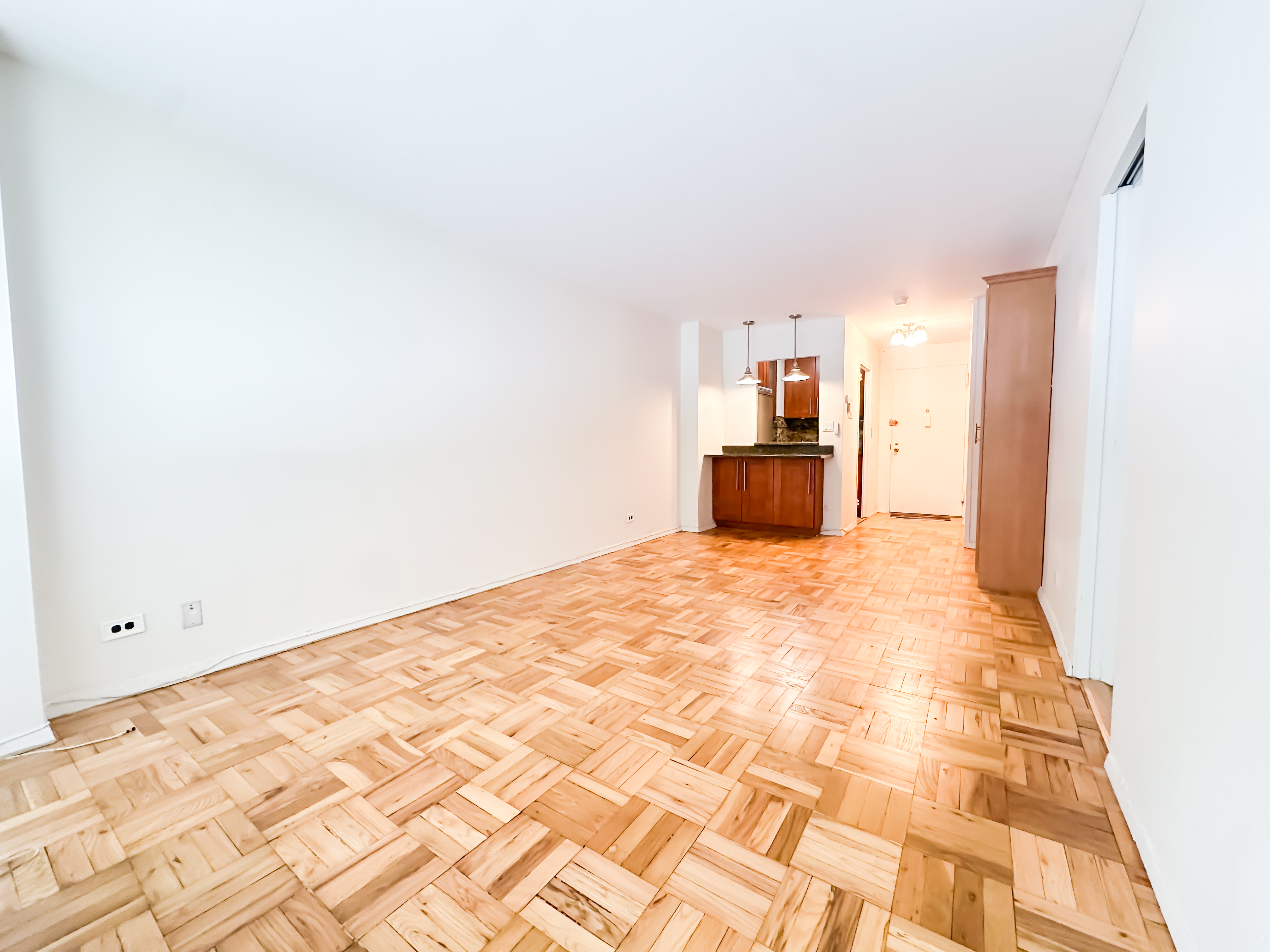 301 East 22nd Street, Unit 2H Manhattan, NY 10010 - Photo 4 of 16 a bedroom with a bed and a mirror