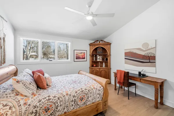 a bedroom with a bed and a dresser