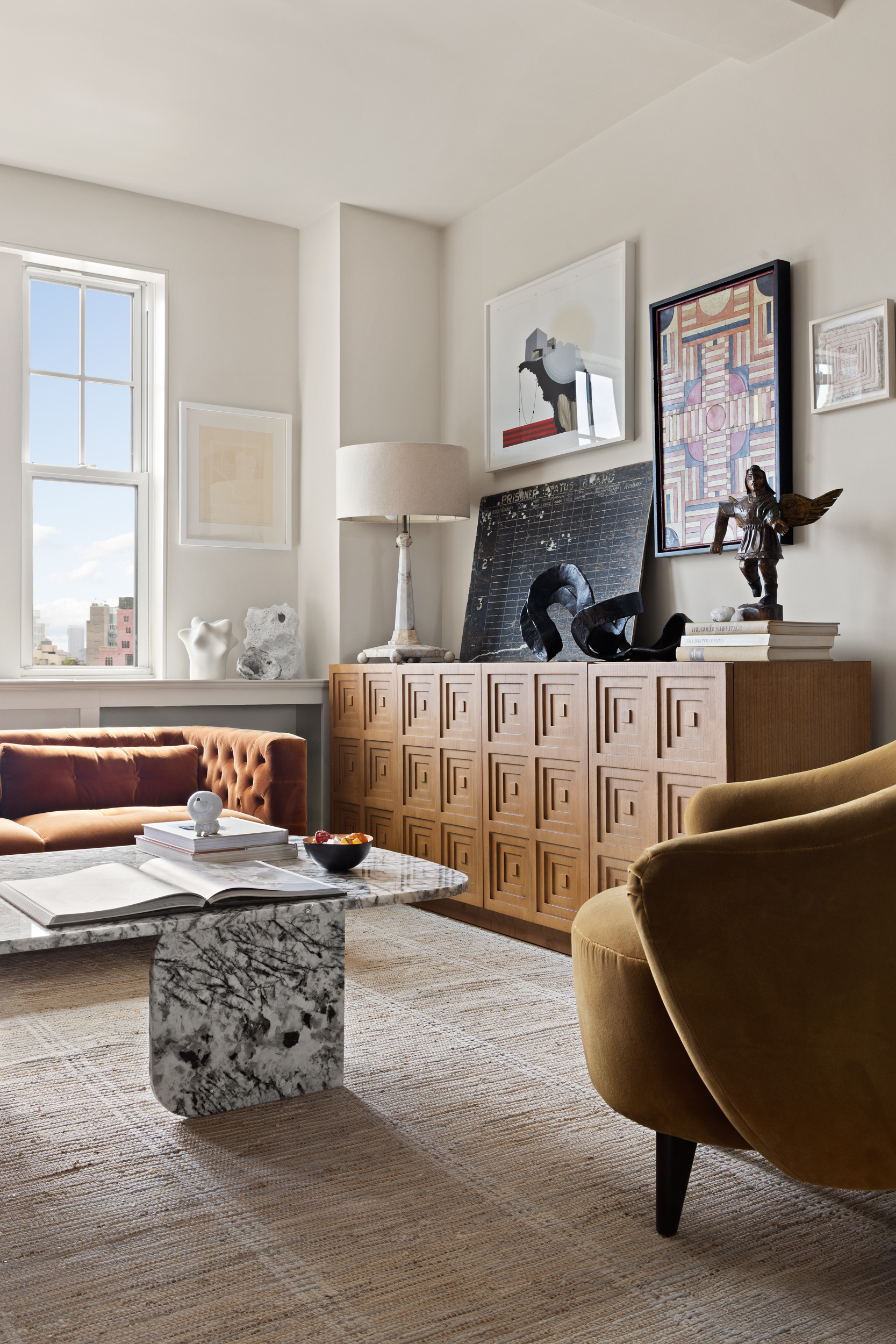 302 West 12th Street, Unit 11F Manhattan, NY 10014 - Photo 5 of 17 a living room with furniture and a flat screen tv