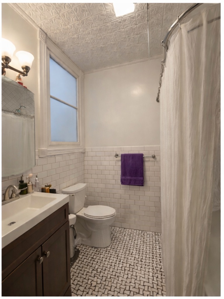481 9th Street, Unit 4 Brooklyn, NY 11215 - Photo 31 of 33 a bathroom with a sink toilet a mirror and shower