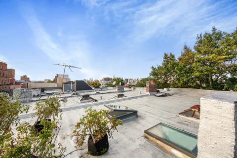 a view of a swimming pool with a lounge chair